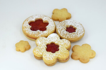 Linzer cookies on a white background, flowers and round shape