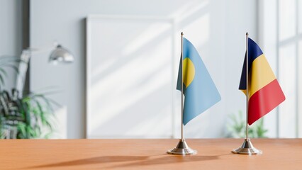 FLAGS OF PALAU AND ROMANIA ON TABLE