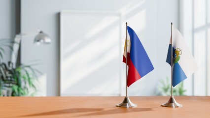 FLAGS OF PHILIPPINES AND SAN MARINO ON TABLE