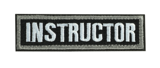 Instructor cloth label tag embroidery isolated on white background. Military or civilian symbol on cloth 