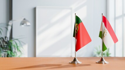 FLAGS OF PORTUGAL AND TAJIKISTAN ON TABLE