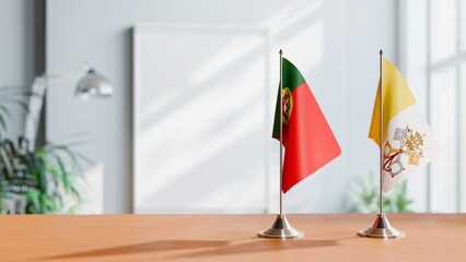 FLAGS OF PORTUGAL AND VATICAN ON TABLE