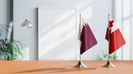 Obraz premium FLAGS OF QATAR AND TONGA ON TABLE