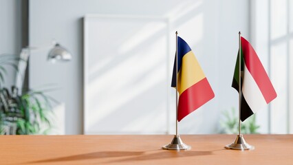 FLAGS OF ROMANIA AND SUDAN ON TABLE