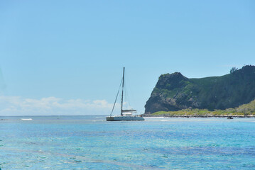 Obraz premium Île Plate (Flat Island) is a picturesque island in the Indian Ocean with a catamaran near located off the northern coast of Mauritius.