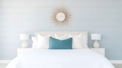 A modern coastal bedroom with light blue walls, white furniture, and a calming seaside ambiance, creating a serene and relaxing atmosphere ideal for coastal living and contemporary interior design ins