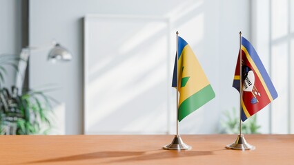FLAGS OF SAINT VINCENT AND SWAZILAND ON TABLE