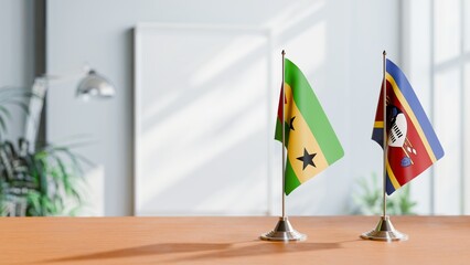 FLAGS OF SAO TOME AND SWAZILAND ON TABLE