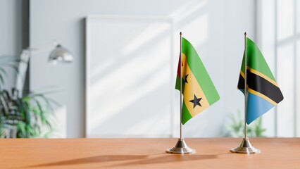 FLAGS OF SAO TOME AND TANZANIA ON TABLE