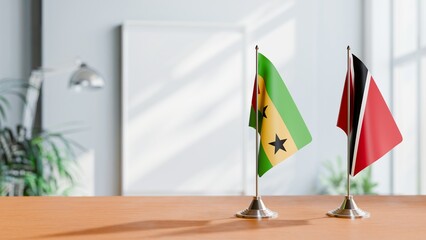 FLAGS OF SAO TOME AND TRINIDAD ON TABLE