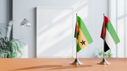FLAGS OF SAO TOME AND UAE ON TABLE