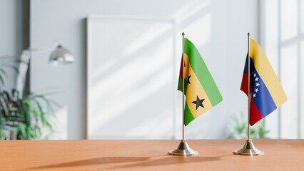 FLAGS OF SAO TOME AND VENEZUELA ON TABLE