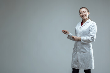 Young female scientist using digital tablet in laboratory