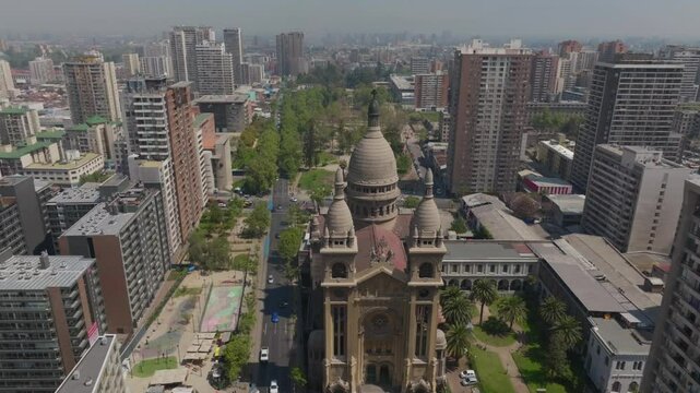 Aerial view of the Sacramental Basilica, you can see Santa Isabel Street with car traffic.