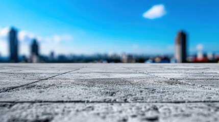 Fototapeta premium A blurred skyline view with a focus on a textured concrete surface, conveying a sense of depth and urban landscape.
