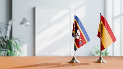 FLAGS OF SPAIN AND SWAZILAND ON TABLE