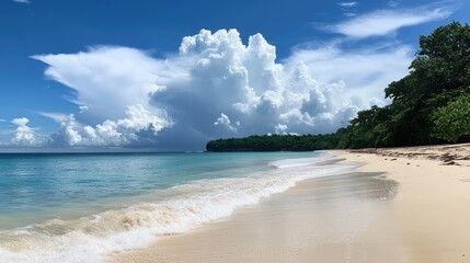 Tranquil beach scene with a clear blue sky, soft waves, and lush greenery enhancing the serene coastal landscape