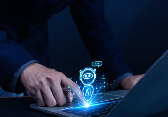 Businessman chatting with AI or artificial intelligence technology. A man uses a laptop computer to chat with an intelligent AI.