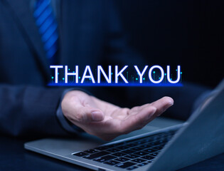 Businessman using laptop and showing thank you message. Concept of congratulation, appreciation, presentation from digital technology. Thank you in business and gratitude.