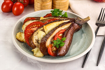 Baked tomato with mozzarella and tomato