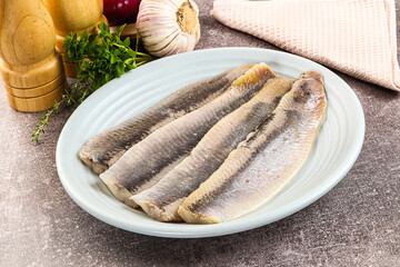 Marinated salted herring fillet apetizer
