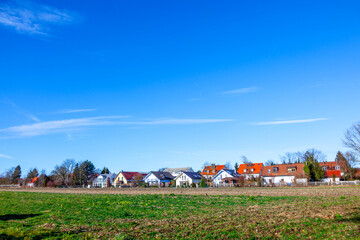Fototapeta premium suburban area of munich with fields and family houses at horizon, Munich, Germany