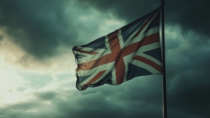 The London City Flag on a windy day, against a cloudy and moody backdrop.