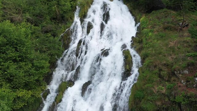 Wilderness Whispers: Aerial View of a Waterfall in the Heart of Nature