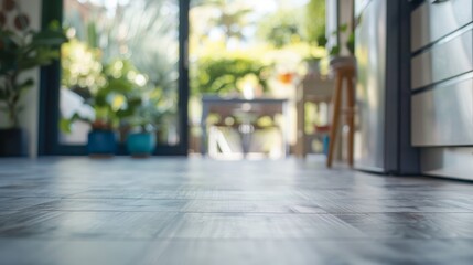 Fototapeta premium Modern open space kitchen with sunlit hardwood floors and lush indoor plants.