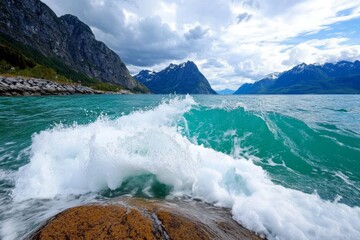 A rocky fjord coastline with dramatic waves crashing against the cliffs under a cloudy sky