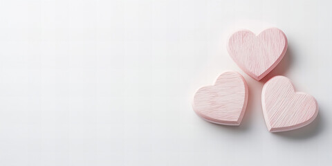 Obraz premium Pink wooden hearts on rustic backgrounds symbolizing love, romance, and Valentine's Day, perfect for wedding invitations, romantic greeting cards, anniversaries, and festive decor with copy-ready empt