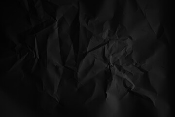 Crumpled black paper with a bold grunge texture. Perfect for dramatic backgrounds, graphic design, posters, or digital art needing a rough, vintage, or handmade look.