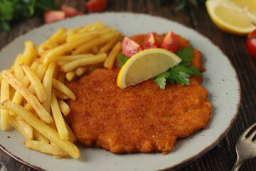 A Viennese schizel with french fries	