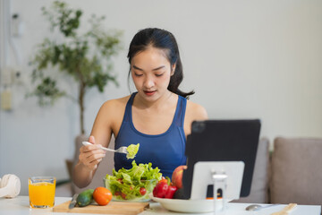 Fit woman enjoys healthy fruit breakfast after yoga training. fitness, nutrition, healthy lifestyle.