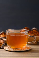 Bael fruit herbal drink in cup glass on wooden background, Healthy drink