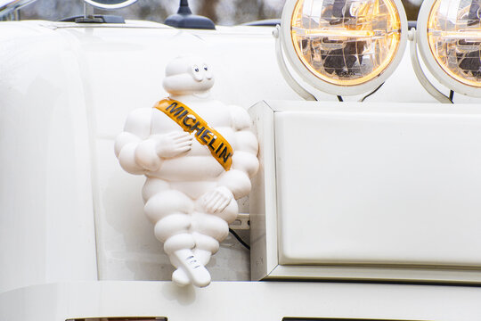 Geneva, Switzerland - December 15, 2024: on a Dutch truck the sign and logo of Bibendum, Michelin Tire Man the mascot of Michelin a French multinational tire manufacturing company