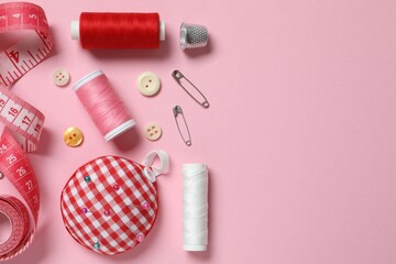 Flat lay composition with different sewing supplies on color background