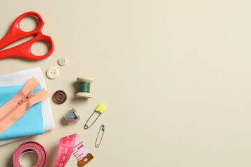 Flat lay composition with different sewing supplies on white background