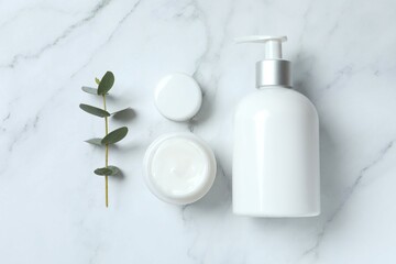 Natural biocosmetics from herbs and plants for the skin on a marble background