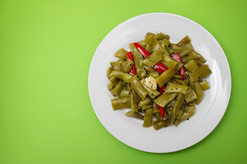 boiled green beans with garlic on plate
