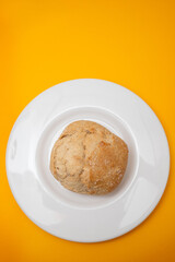 home made small bread with mix cereals on white plate