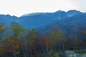 At Iwatake Ski Resort, Hakuba, Nagano, Japan easily see the beautiful scenery of the Japan Alps. In particular during the autumn foliage season, can see the colors of the leaves and the snow on top. 