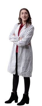 Young confident female technician wearing a lab coat poses with crossed arms on transparent  looking directly at the camera with a serious, determined expression