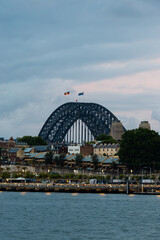 Sydney Harbour Bridge with cloudy sky.