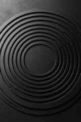 Obraz premium Abstract black circular design with layered rings creating depth and texture against a dark background.