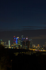 Fototapeta premium Long exposure photograph of Moscow cityscape. View from Vorobyovy Gory to skyscrapers of Moscow business district.