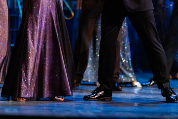 Closeup of legs dancing waltz on theatre stage