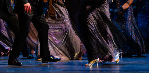 Closeup of legs dancing waltz on theatre stage