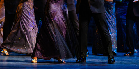 Closeup of legs dancing waltz on theatre stage