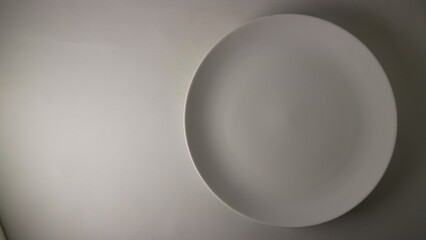 Empty White Oval Plate on White Background